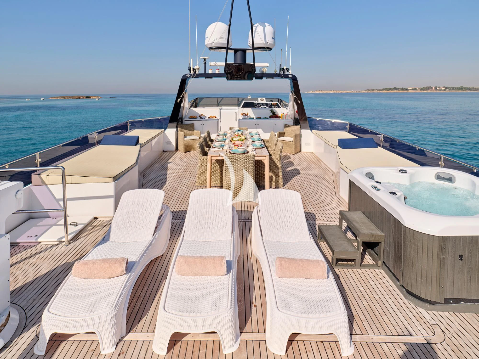 a deck with chairs and a boat on it aboard LADY RINA Yacht for Sale