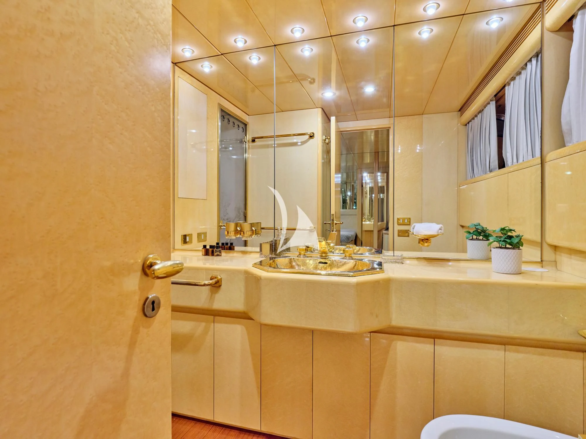 a bathroom with a large mirror aboard LADY RINA Yacht for Sale