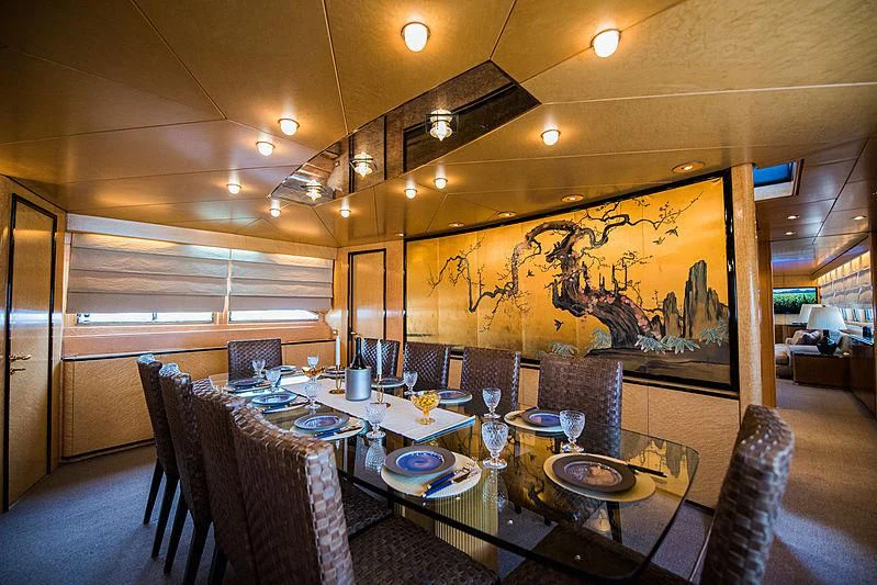 a dining room with a table and chairs aboard LADY RINA Yacht for Sale