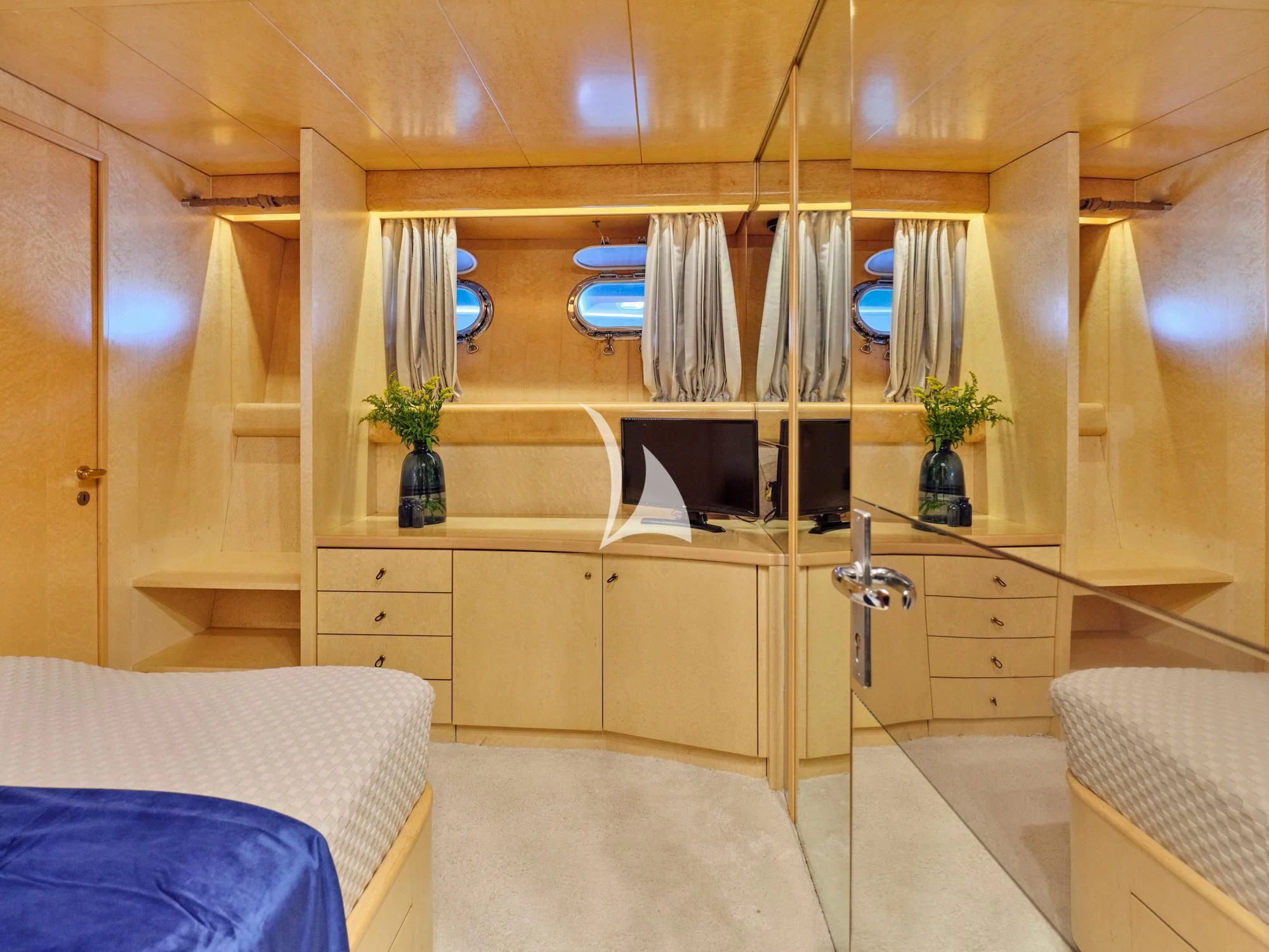 a room with a bed and a desk aboard LADY RINA Yacht for Sale
