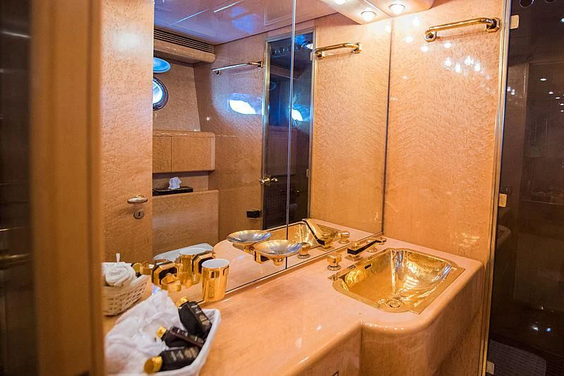 a bathroom with a large mirror aboard LADY RINA Yacht for Sale