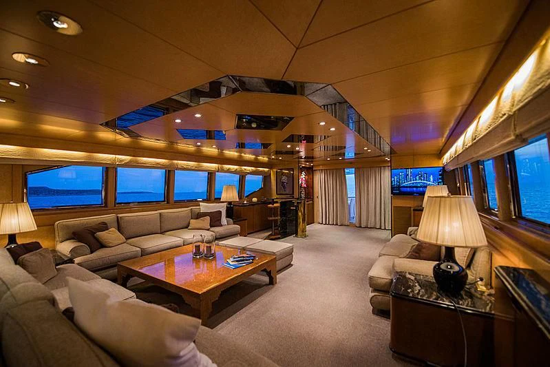 a living room with a large screen aboard LADY RINA Yacht for Sale