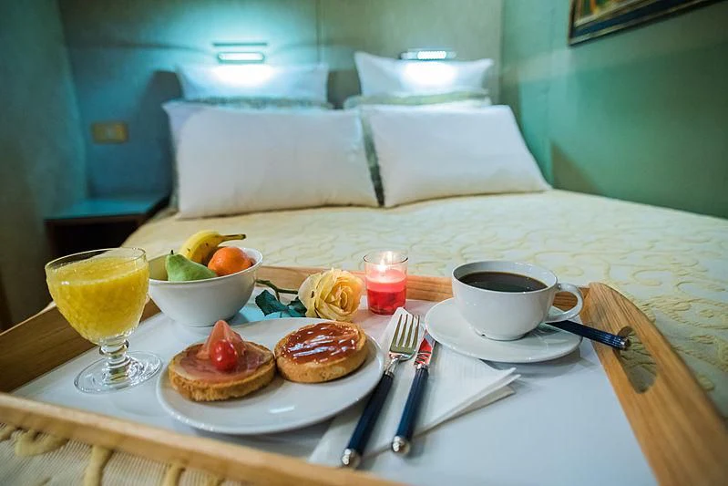 a table with food and drinks on it aboard LADY RINA Yacht for Sale