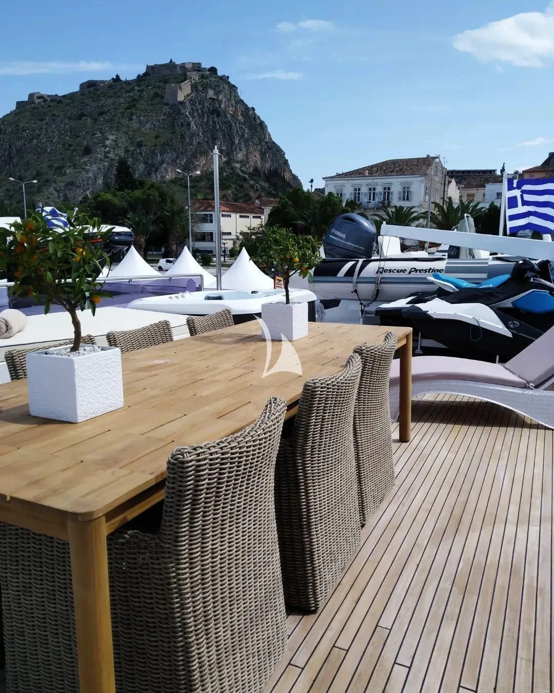 a table with chairs on it aboard LADY RINA Yacht for Sale