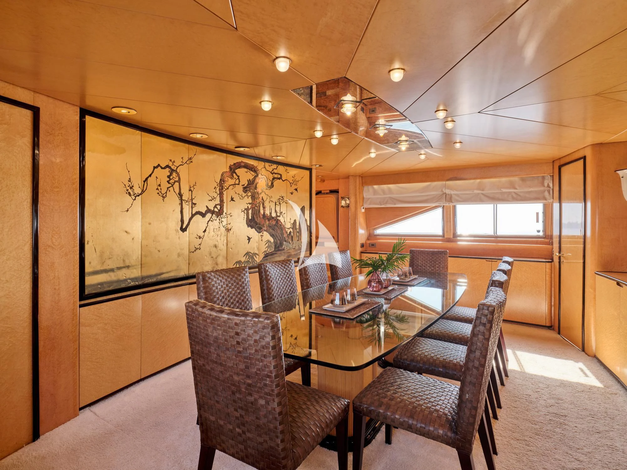 a room with chairs and a table aboard LADY RINA Yacht for Sale