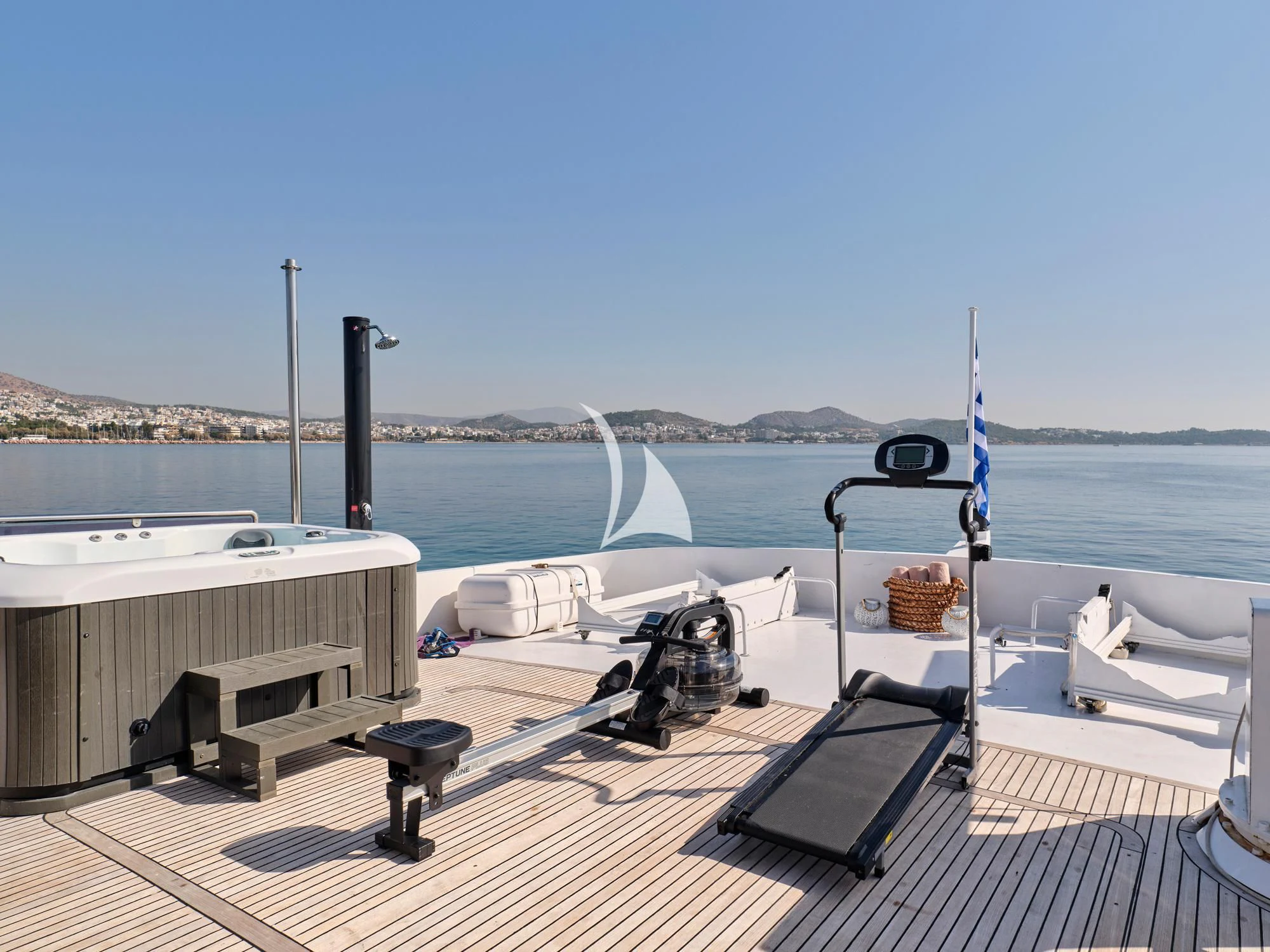 a deck with a chair and a table on it aboard LADY RINA Yacht for Sale