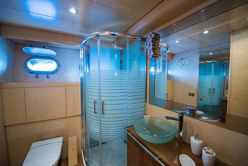 a bathroom with a glass shower aboard LADY RINA Yacht for Sale