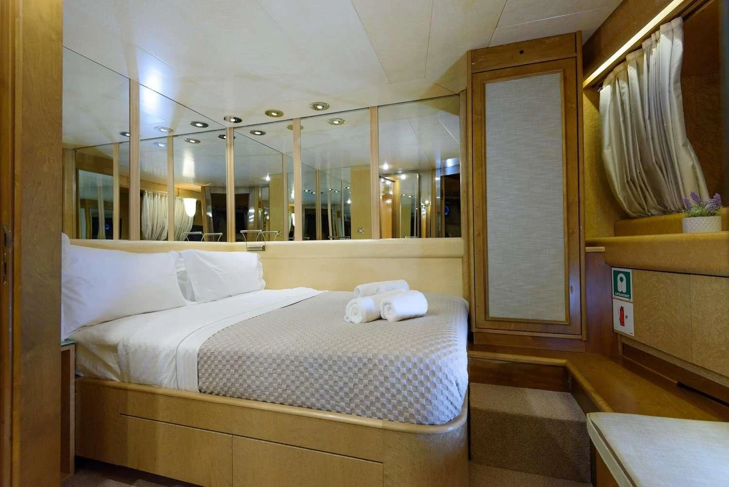 a bed in a room aboard LADY RINA Yacht for Sale