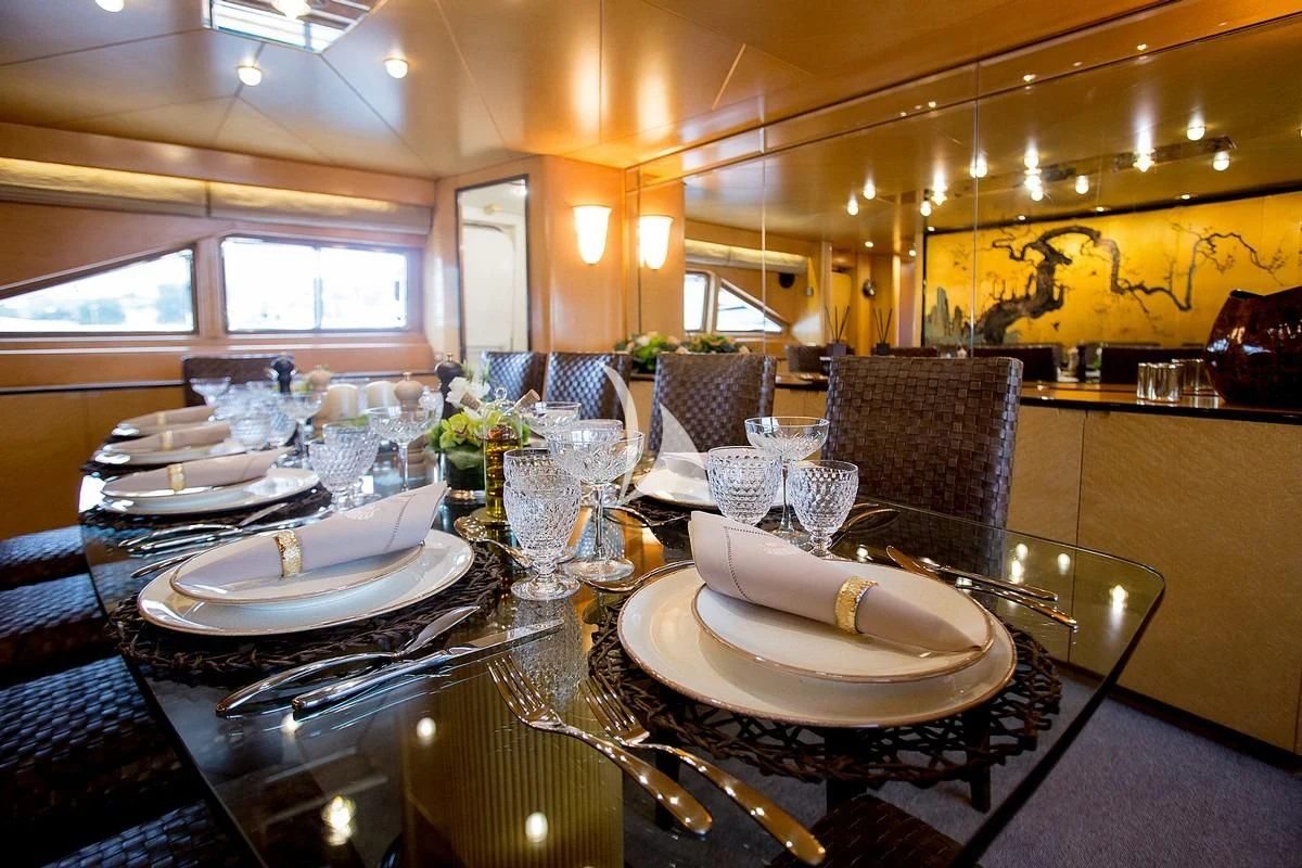 a large dining room table aboard LADY RINA Yacht for Sale