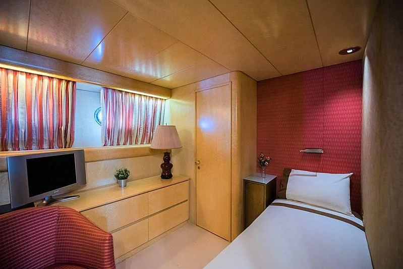 a room with a bed and a tv aboard LADY RINA Yacht for Sale