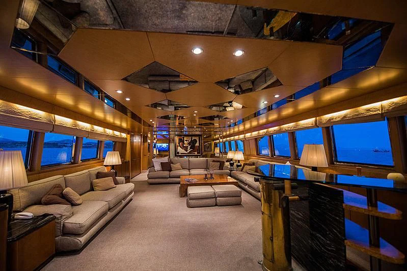 a room with a couch and a tv aboard LADY RINA Yacht for Sale