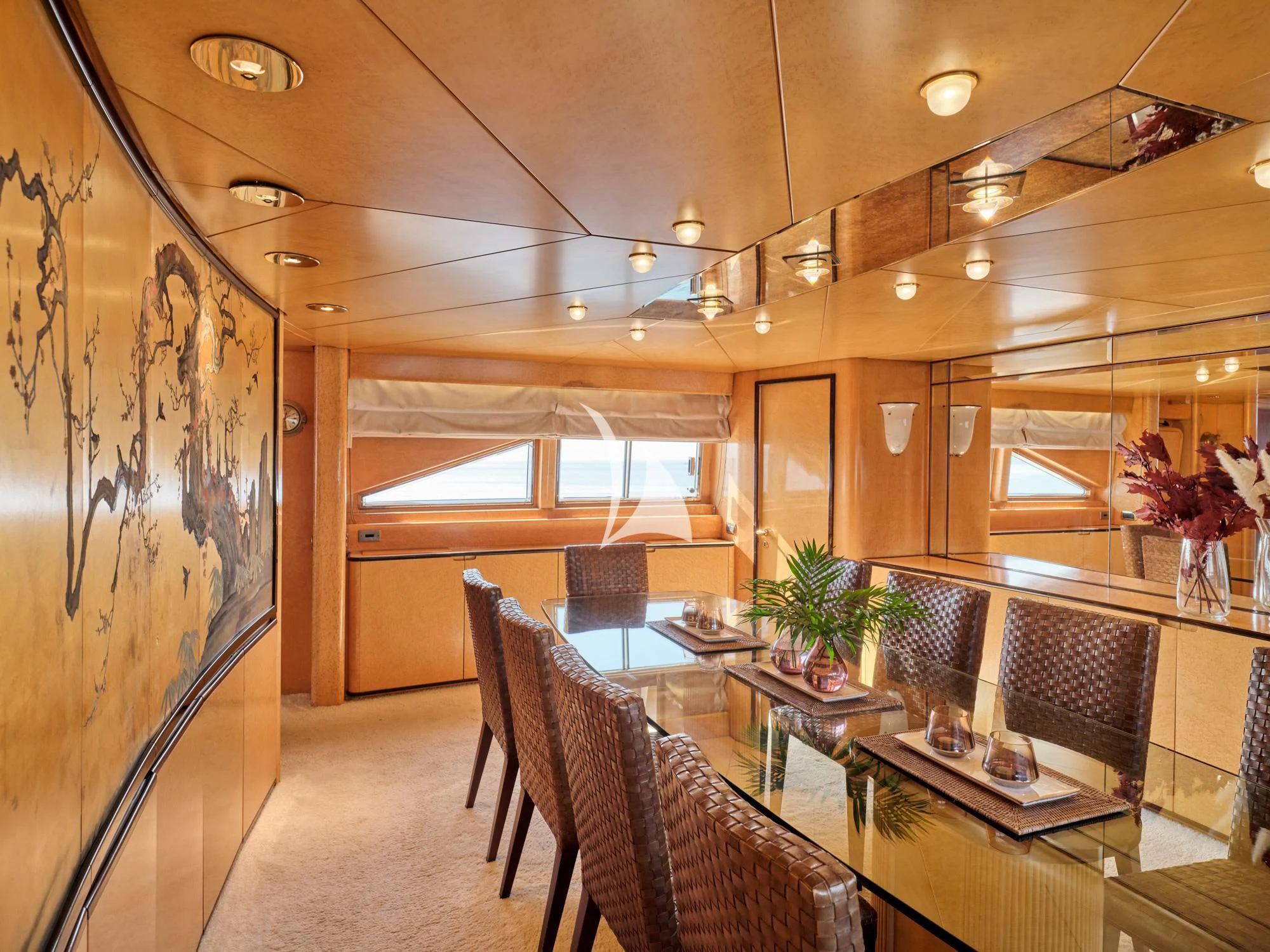 a room with a table chairs and a window aboard LADY RINA Yacht for Sale