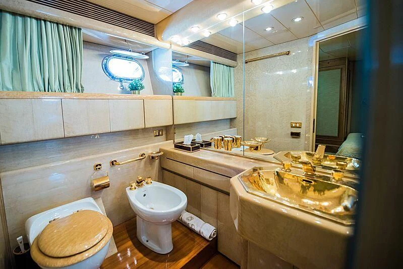a bathroom with a large mirror aboard LADY RINA Yacht for Sale