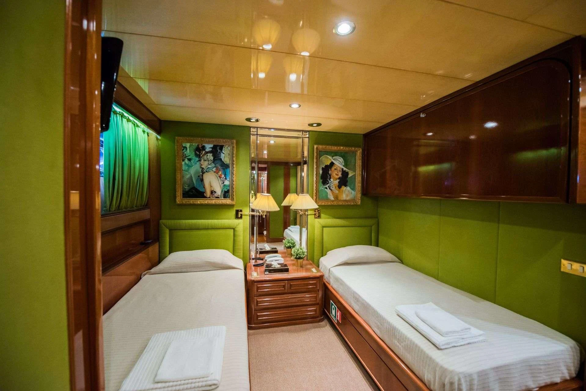 a room with two beds aboard LADY RINA Yacht for Sale