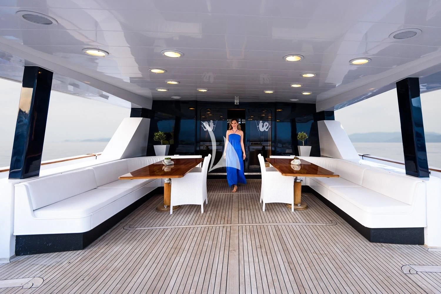 a person walking through a room aboard LADY RINA Yacht for Sale