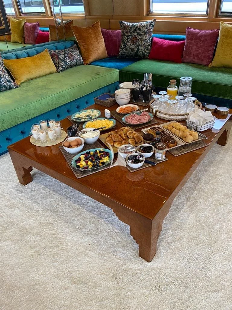 a table with food on it aboard LADY RINA Yacht for Sale