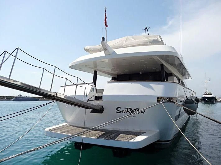 a white boat on a body of water aboard LADY RINA Yacht for Sale