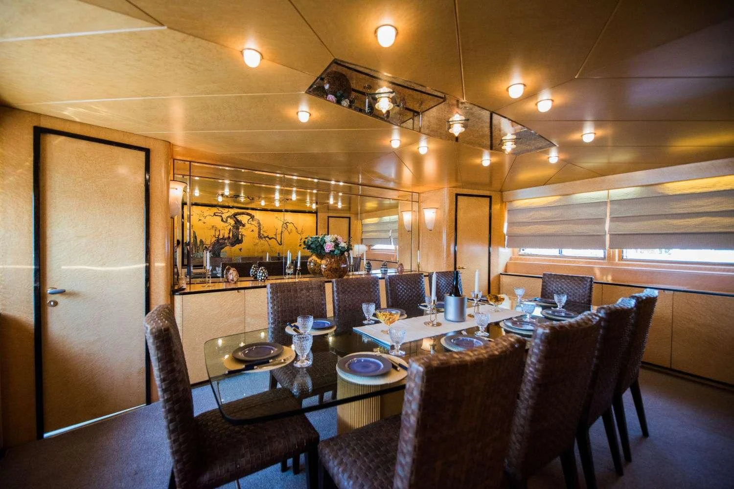 a large kitchen with a dining table aboard LADY RINA Yacht for Sale