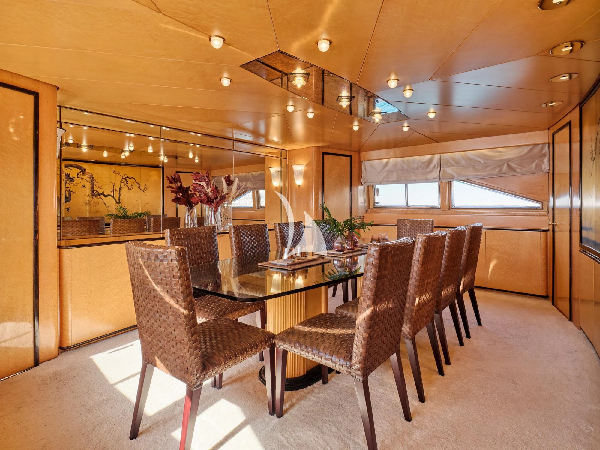 a room with a table and chairs aboard LADY RINA Yacht for Sale
