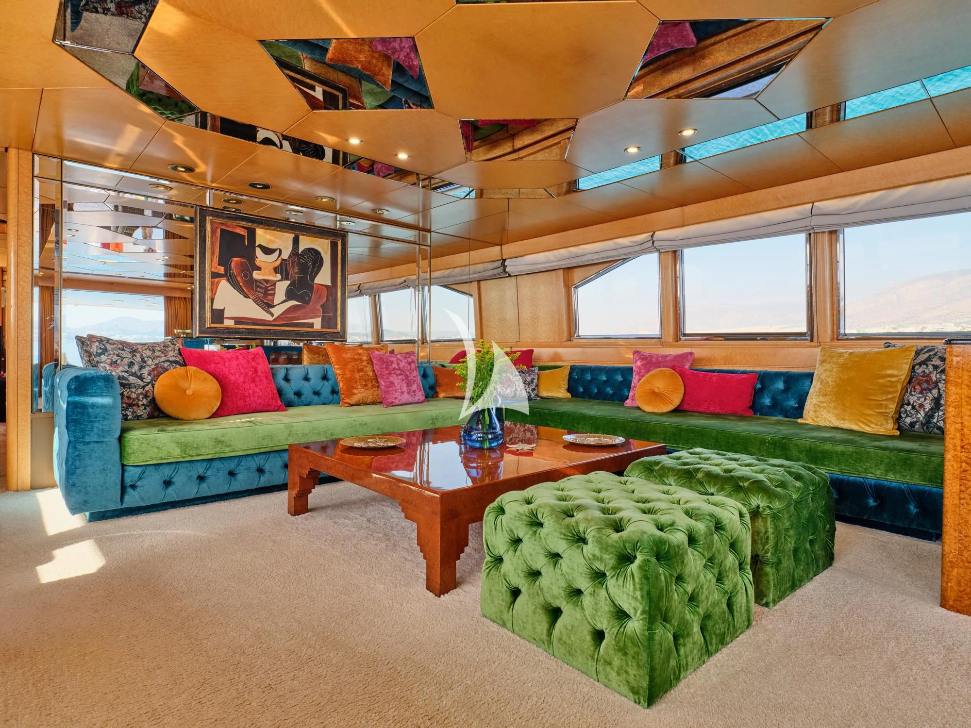 a living room with a couch and a coffee table aboard LADY RINA Yacht for Sale