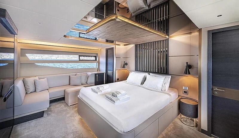 a room with a bed and a couch aboard TUBABU Yacht for Sale