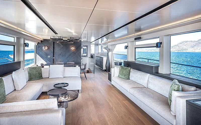 a living room with a large window aboard TUBABU Yacht for Sale