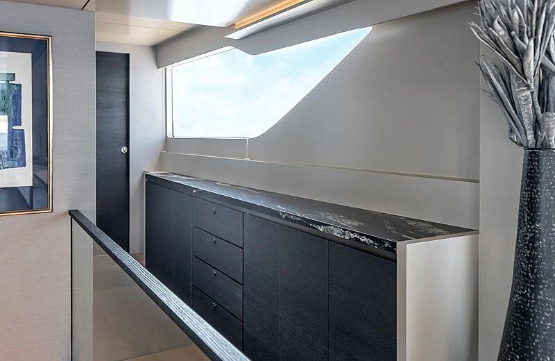 a room with a black cabinet and a black cabinet with drawers aboard TUBABU Yacht for Sale