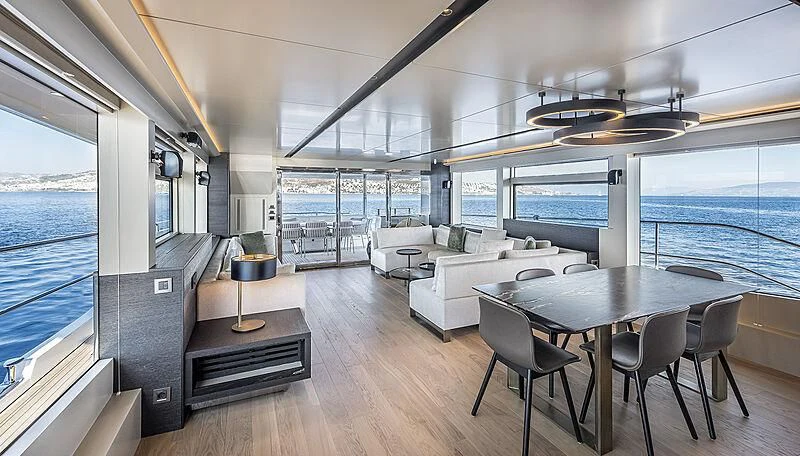 a room with a table and chairs aboard TUBABU Yacht for Sale