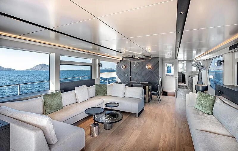 a living room with a large window aboard TUBABU Yacht for Sale