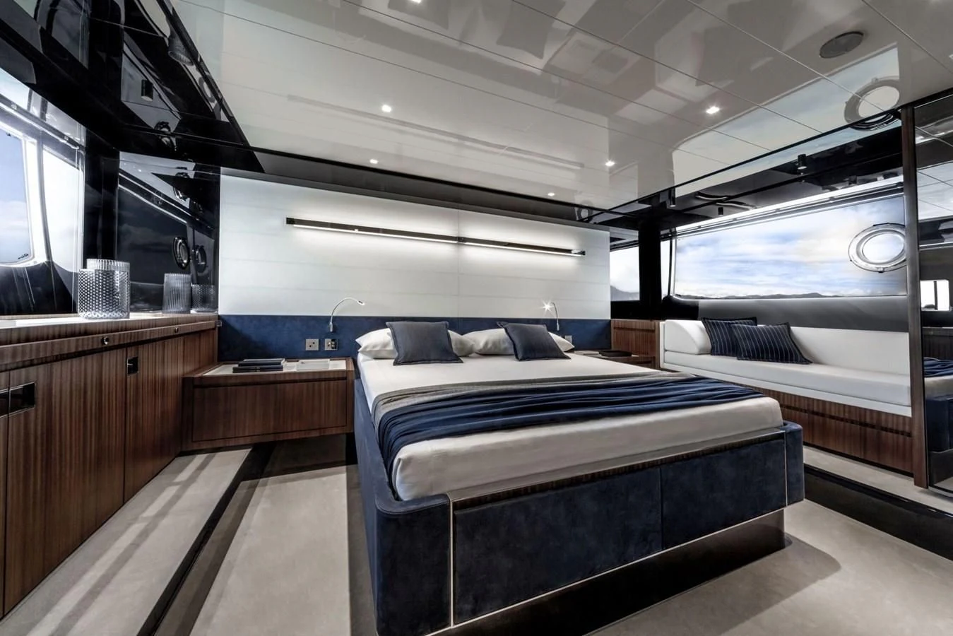 a room with a bed and a window aboard 66' RIBELLE Yacht for Sale