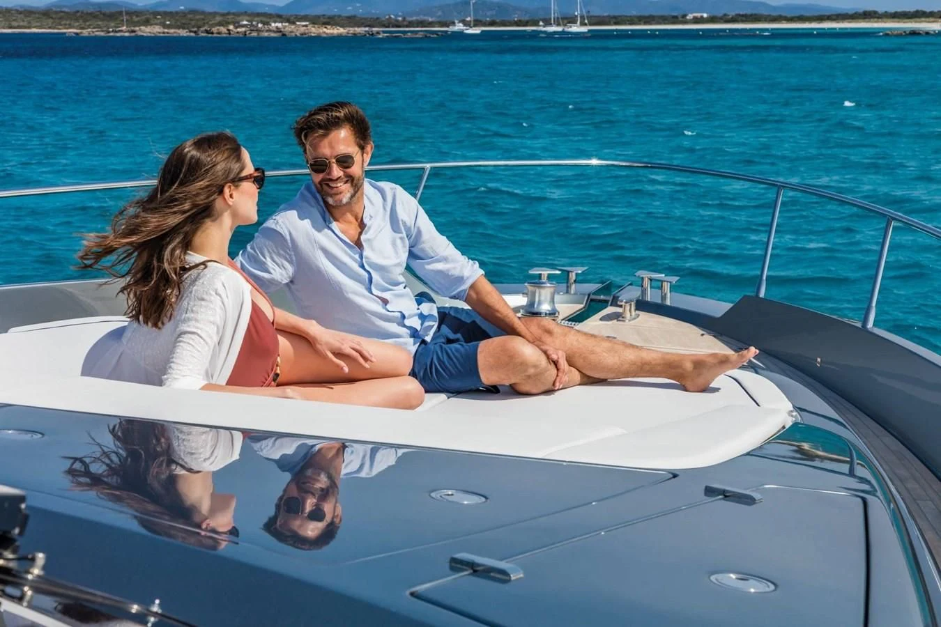 a man and woman on a boat aboard 66' RIBELLE Yacht for Sale
