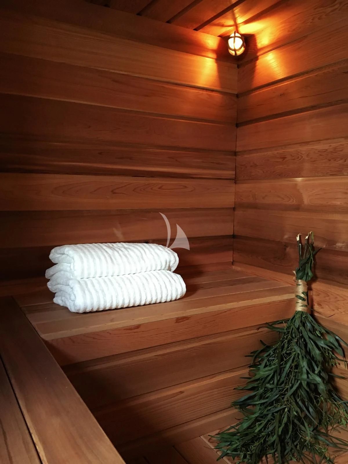 a white towel on a wooden wall aboard BALTO Yacht for Sale