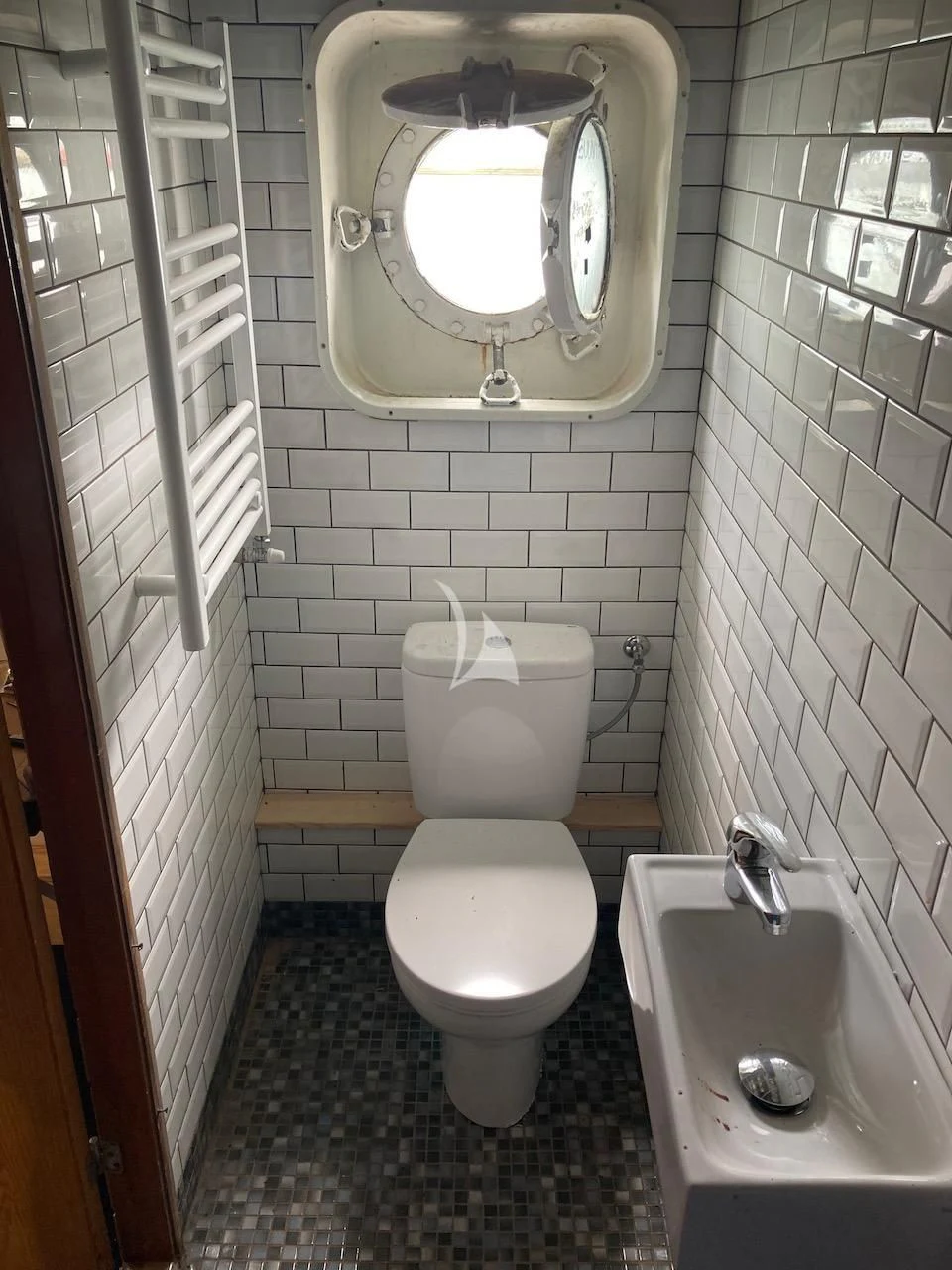 a bathroom with a toilet and sink aboard BALTO Yacht for Sale