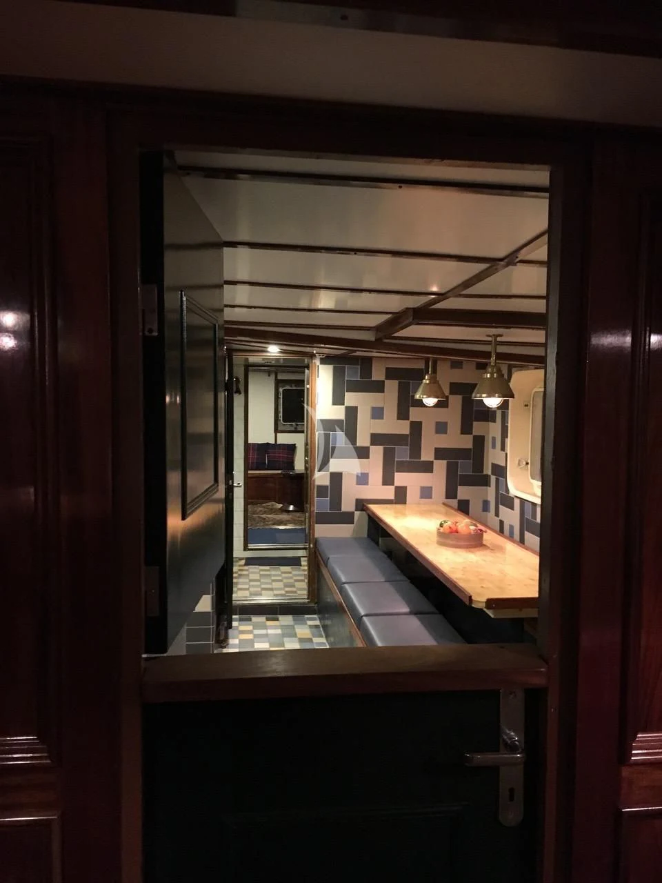 a room with a table and chairs aboard BALTO Yacht for Sale