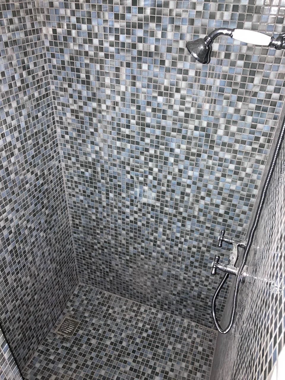 a shower with a tile wall aboard BALTO Yacht for Sale