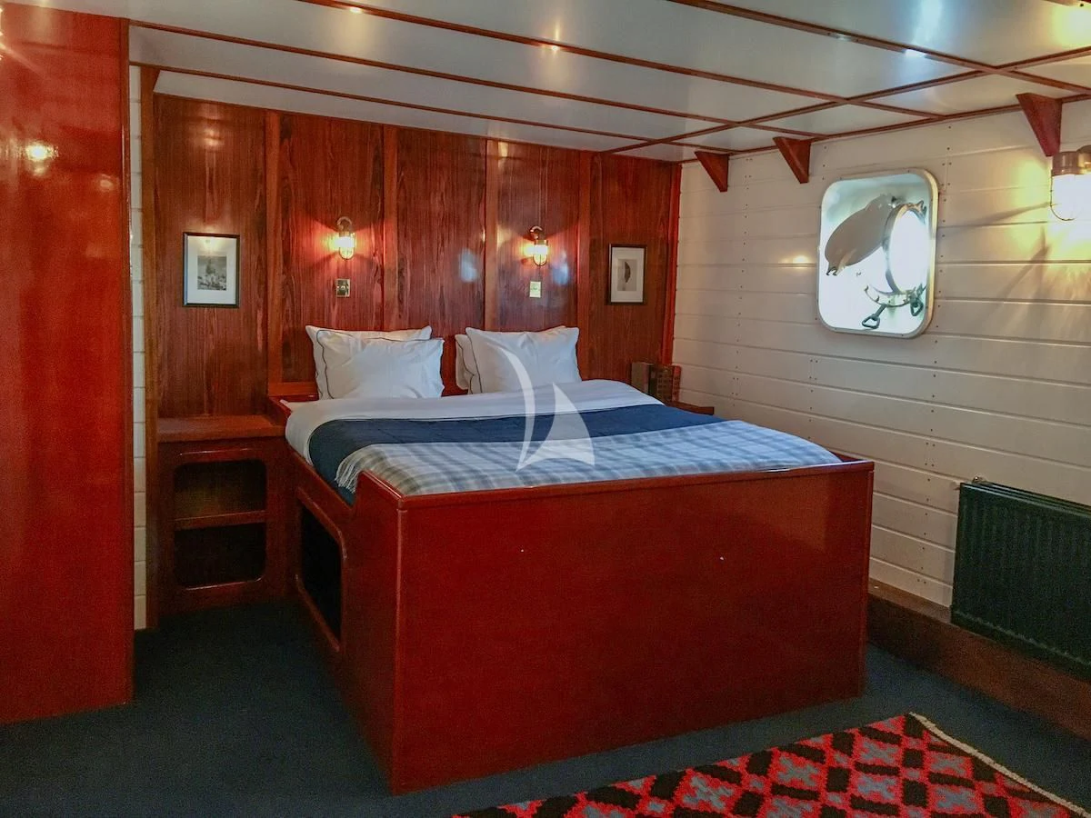 a bed in a room aboard BALTO Yacht for Sale