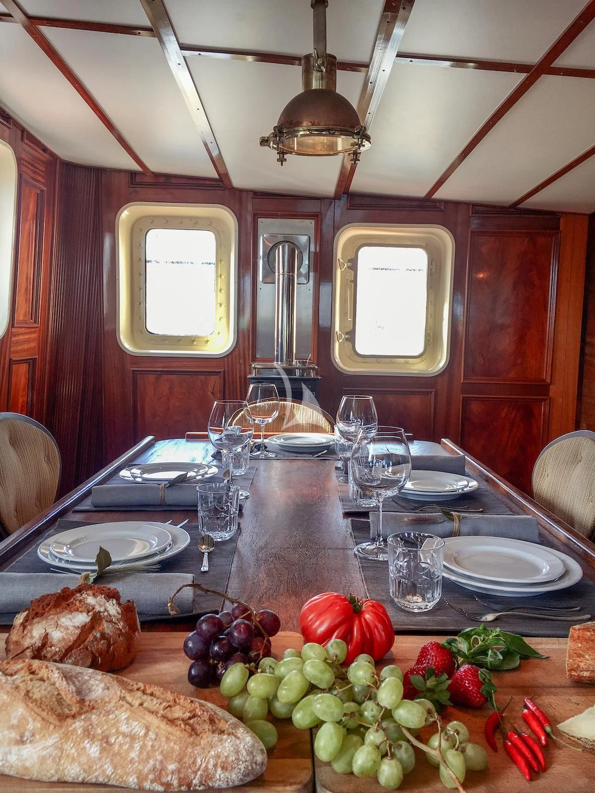 a table with food on it aboard BALTO Yacht for Sale
