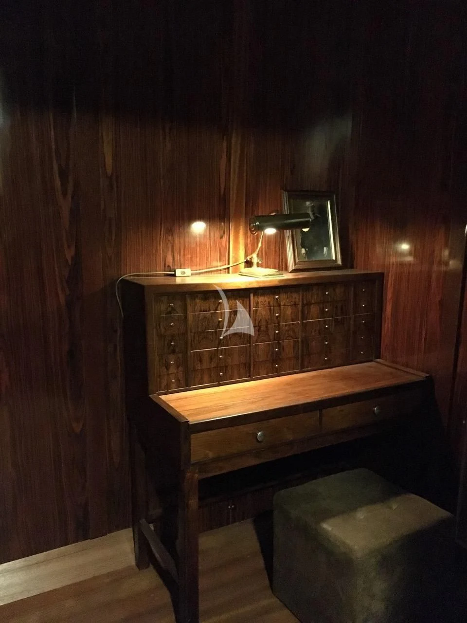 a wooden dresser with a mirror aboard BALTO Yacht for Sale