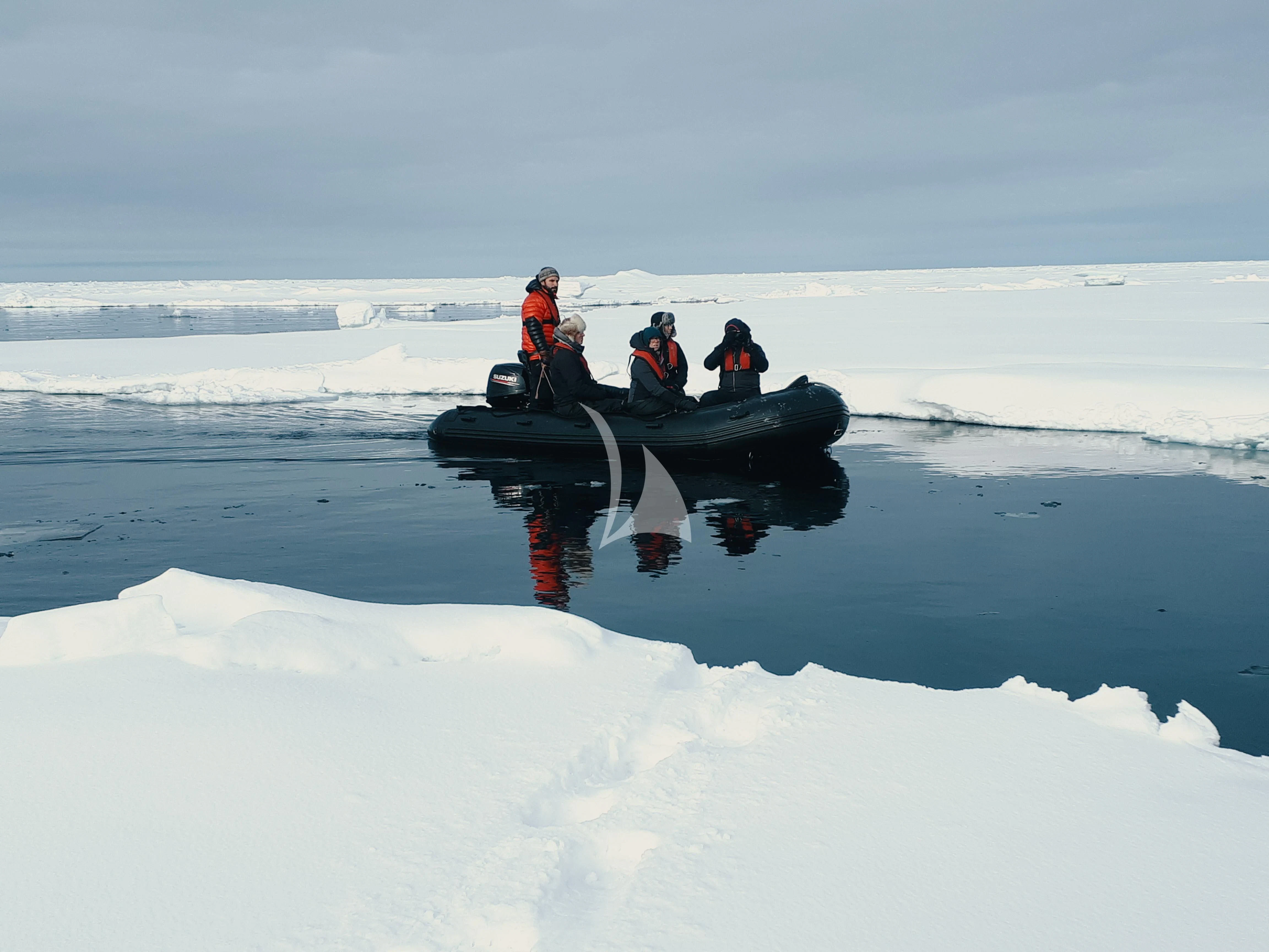 a group of people on a boat in the snow aboard BALTO Yacht for Sale