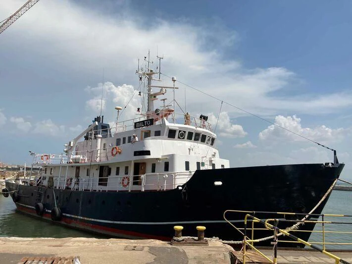 a large ship docked aboard BALTO Yacht for Sale
