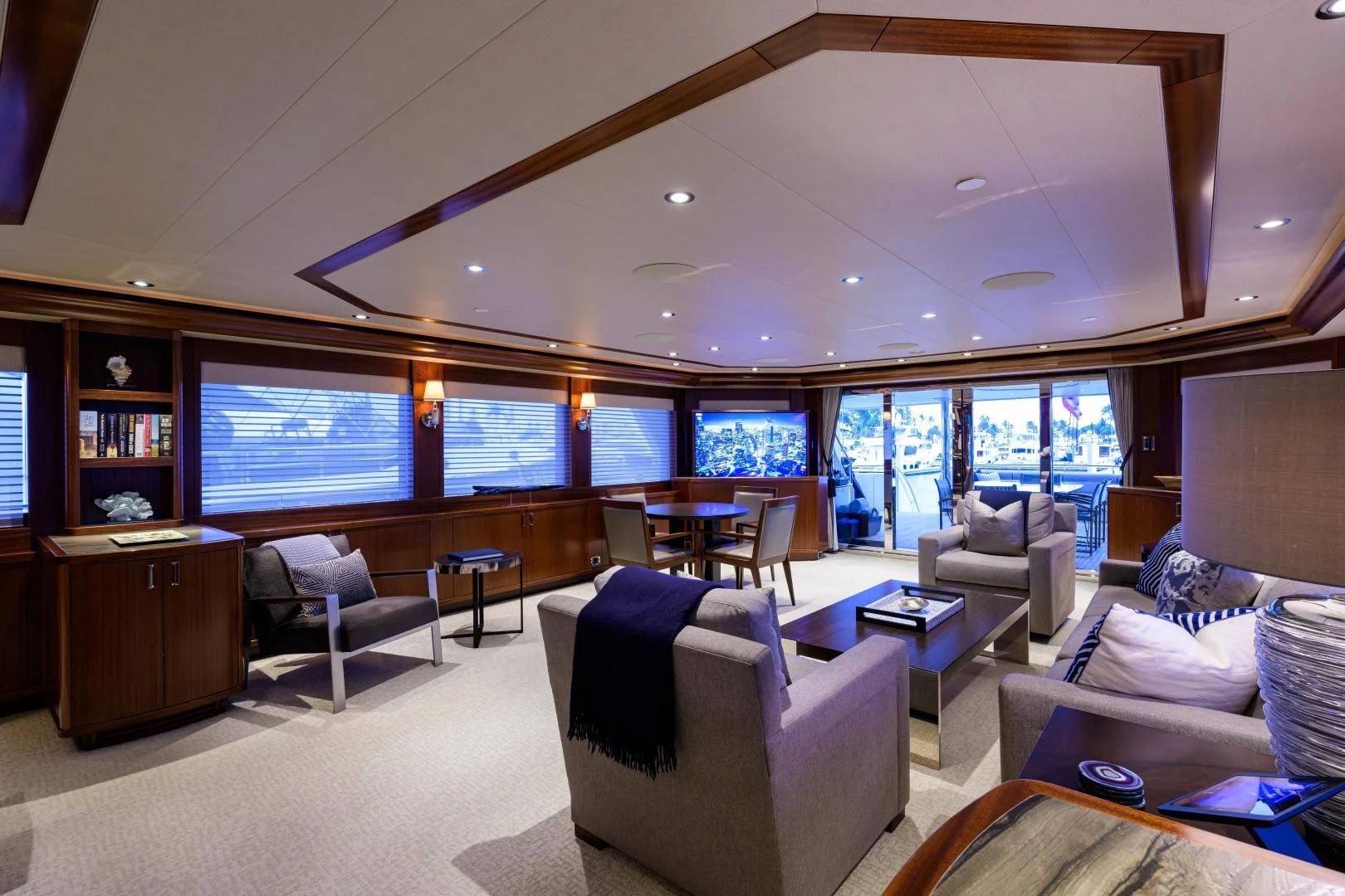 a living room with a large window aboard LADY JJ Yacht for Charter