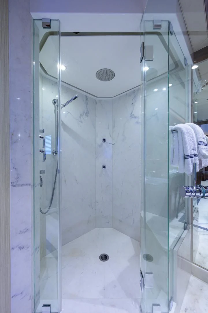 a shower with glass doors aboard LADY JJ Yacht for Charter