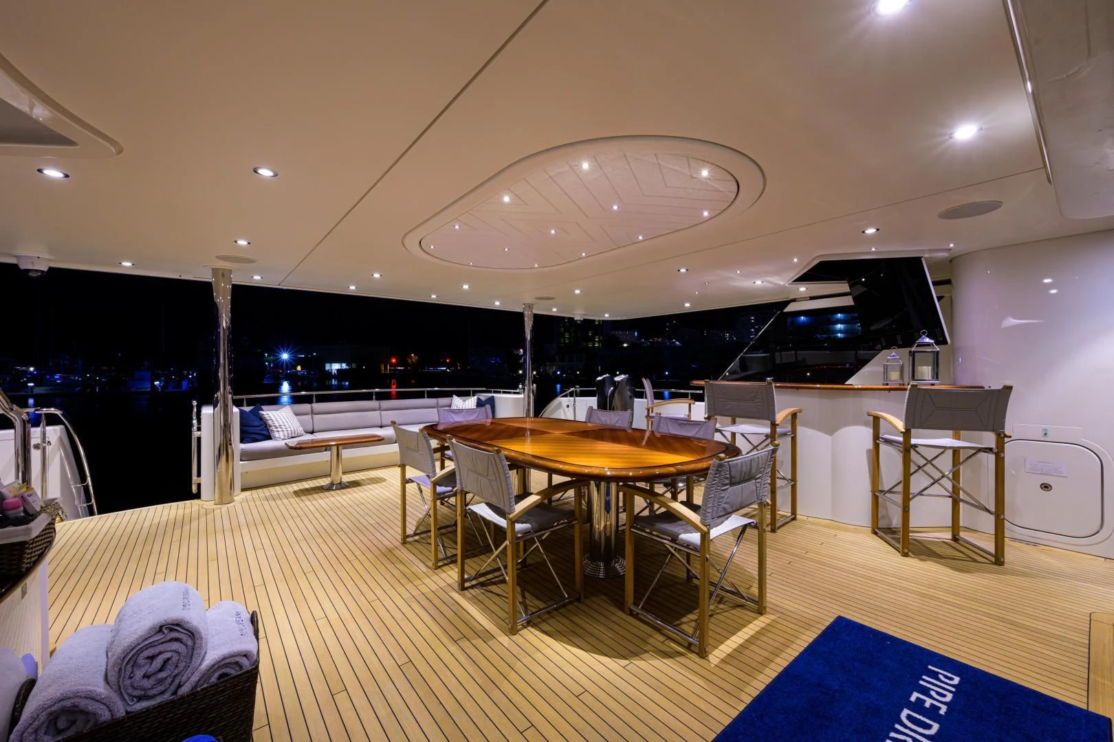 a room with tables and chairs aboard LADY JJ Yacht for Charter