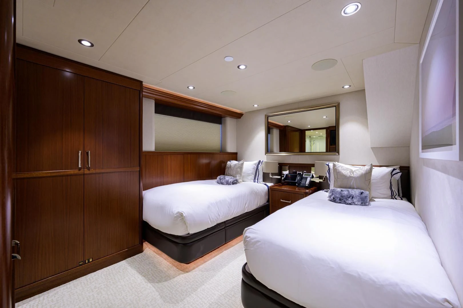 a room with a bed and a cupboard aboard LADY JJ Yacht for Charter