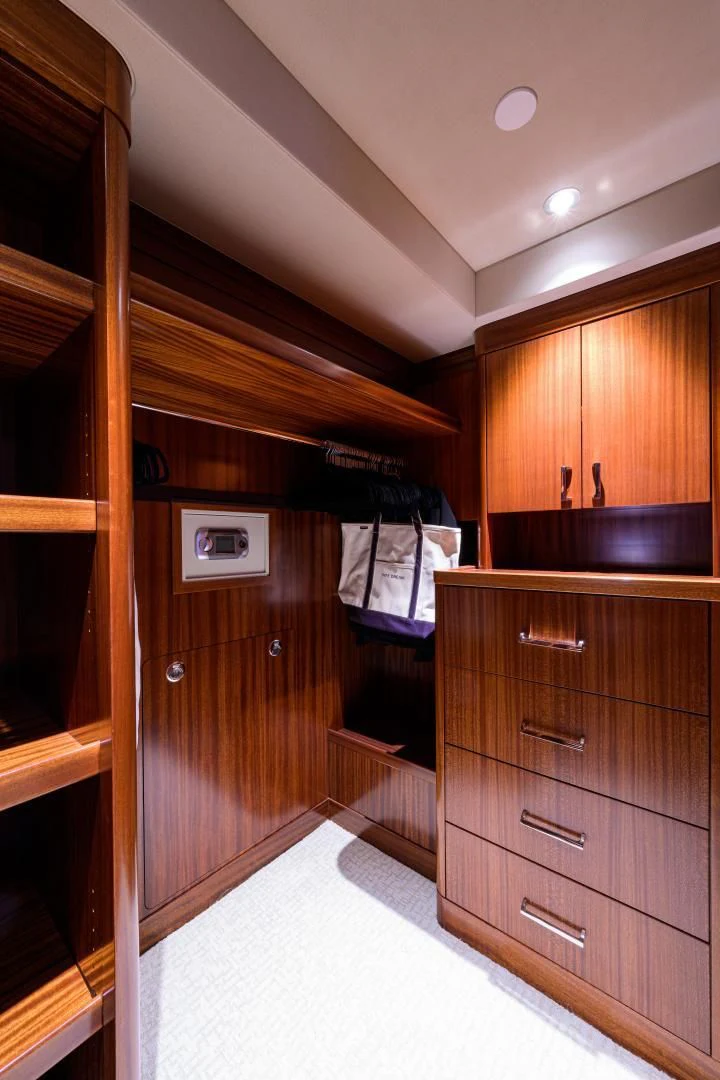 a kitchen with wooden cabinets aboard LADY JJ Yacht for Charter