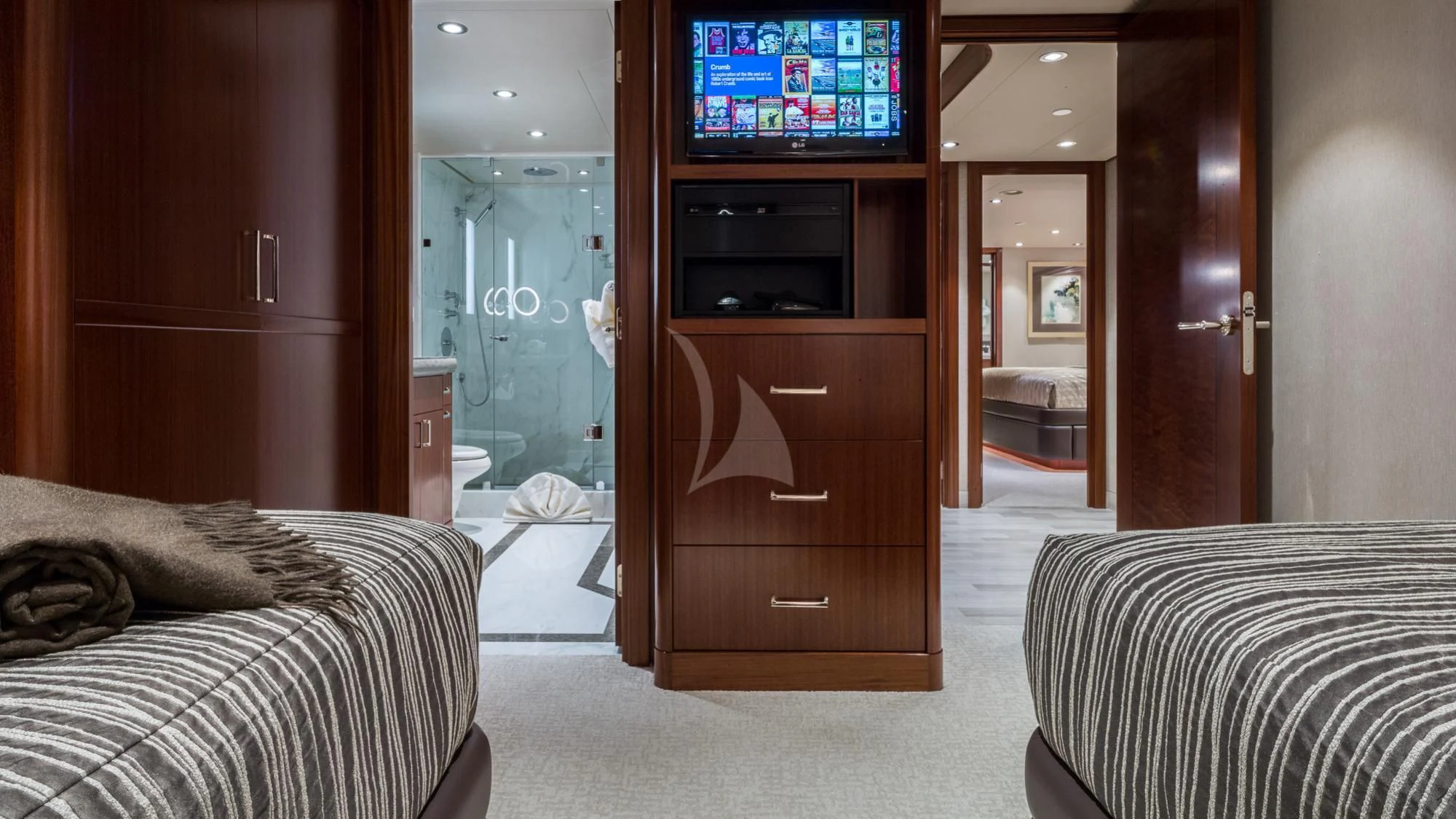 a bedroom with a tv and a bed aboard LADY JJ Yacht for Charter