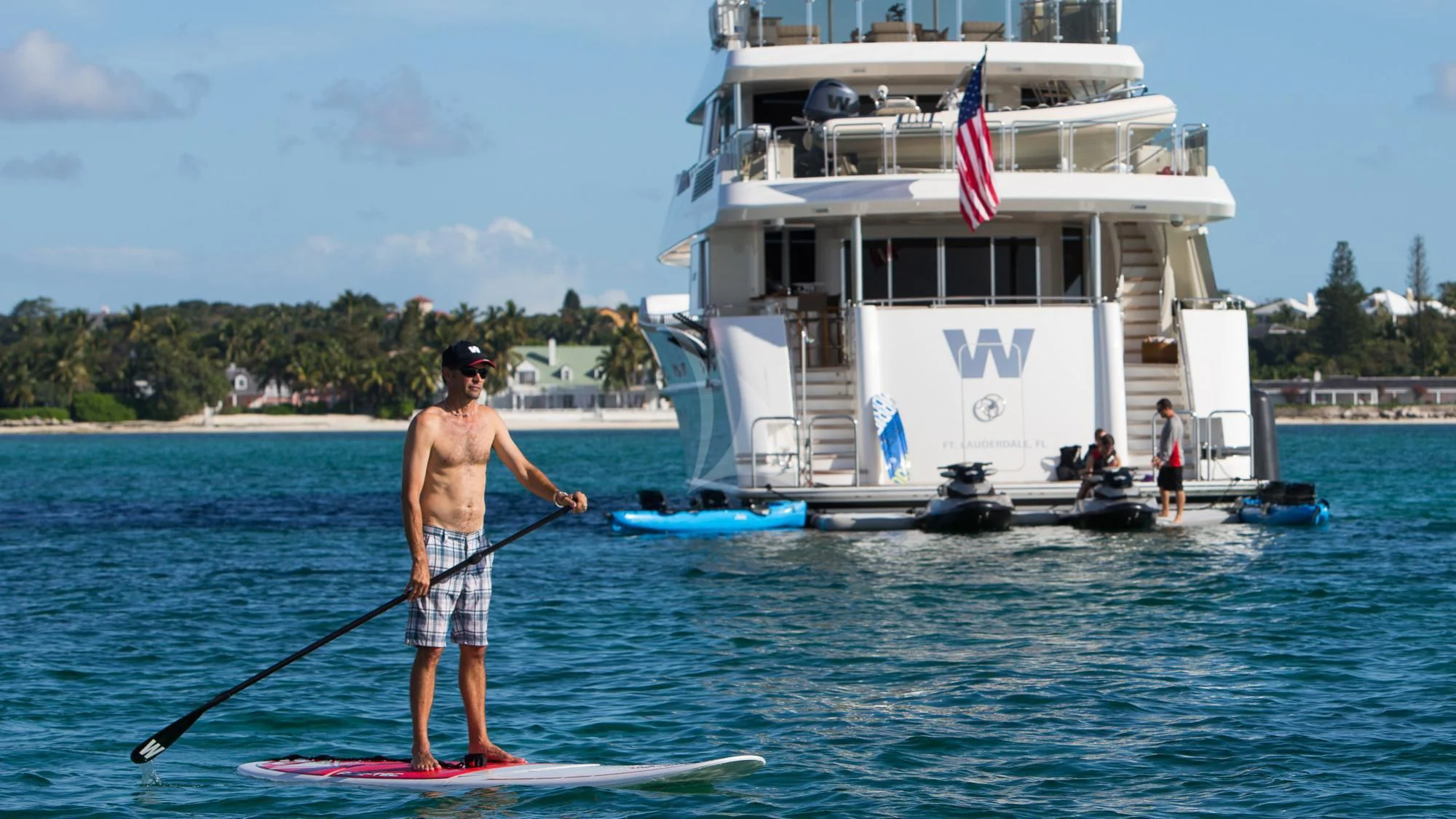 a man on a paddle board aboard LADY JJ Yacht for Charter
