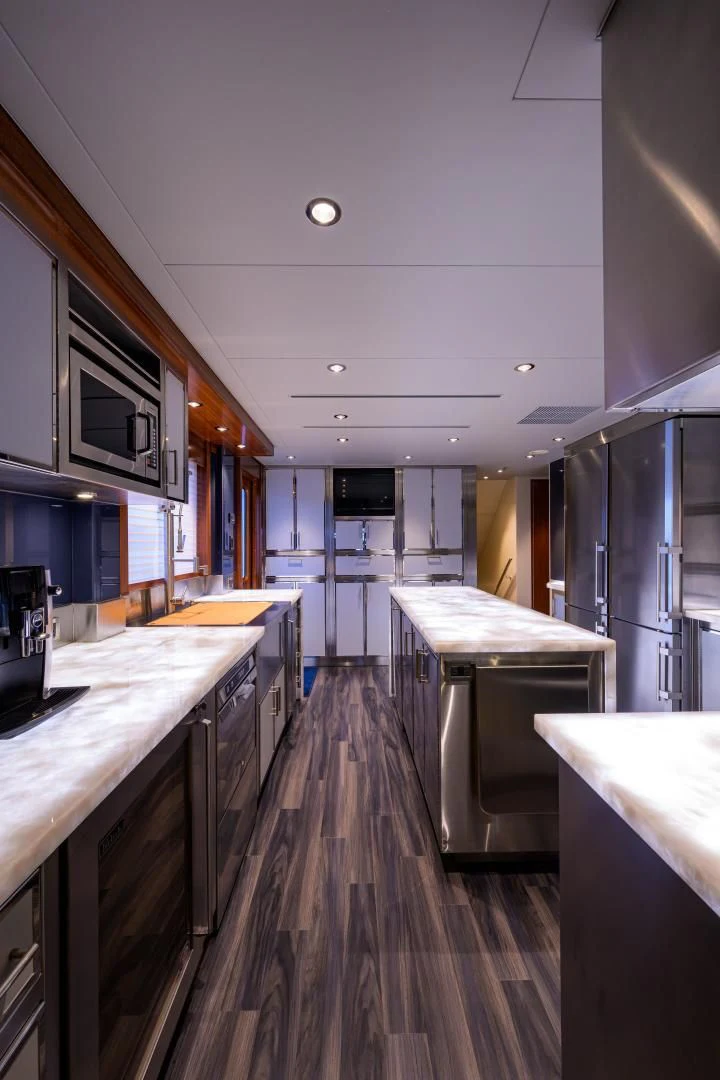 a kitchen with a long counter and cabinets aboard LADY JJ Yacht for Charter