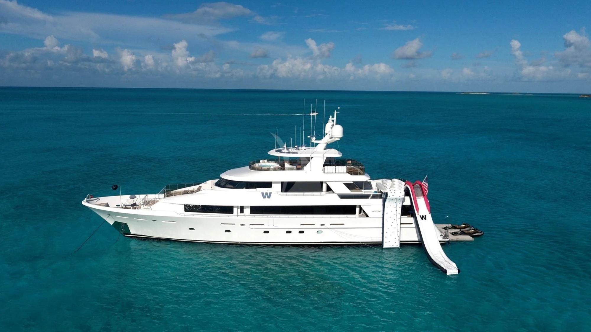 a white boat in the water aboard LADY JJ Yacht for Charter