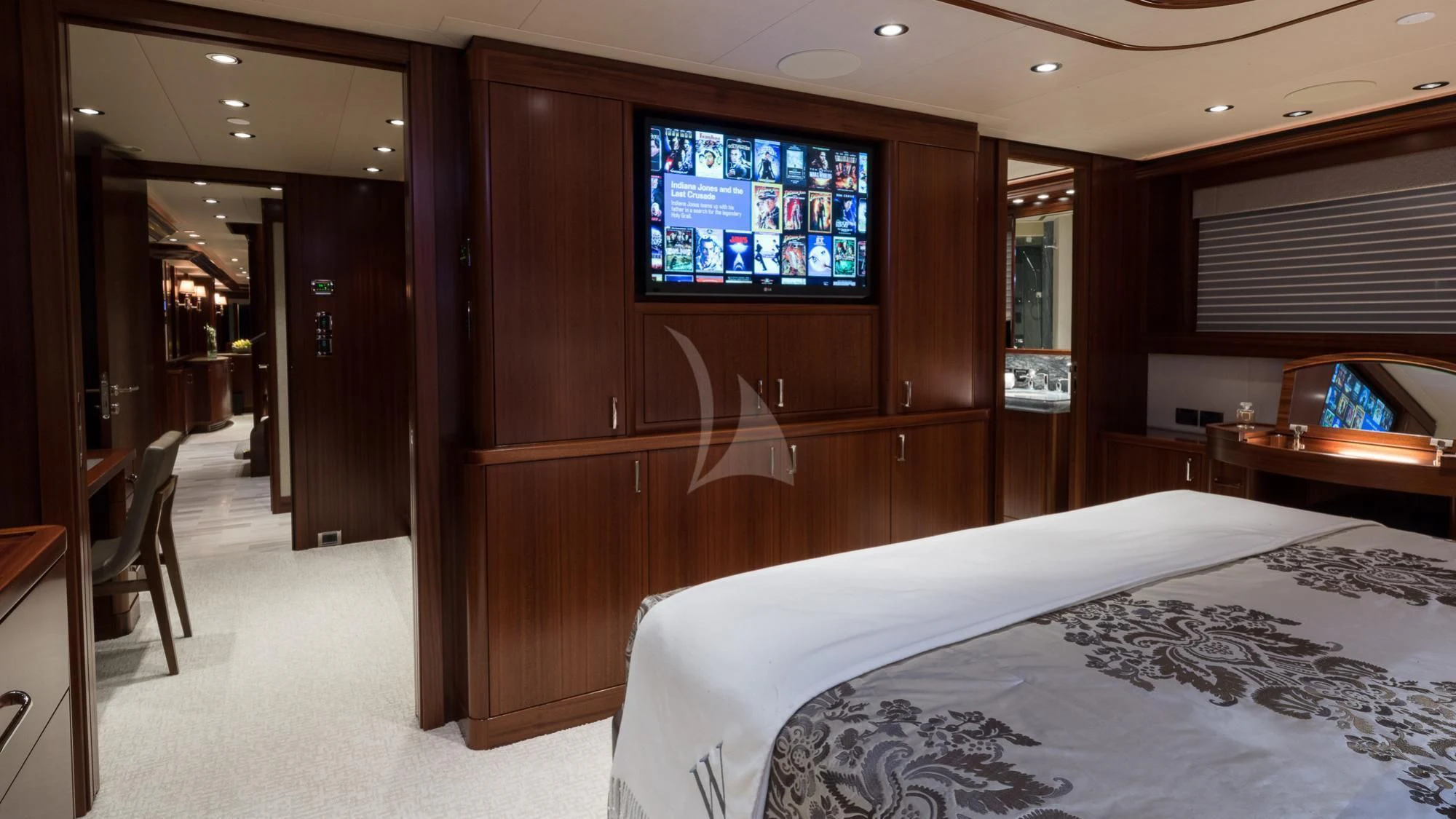 a hotel room with a tv aboard LADY JJ Yacht for Charter